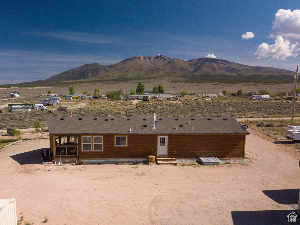 View of mountain backdrop with a desert landscape and rural landscape