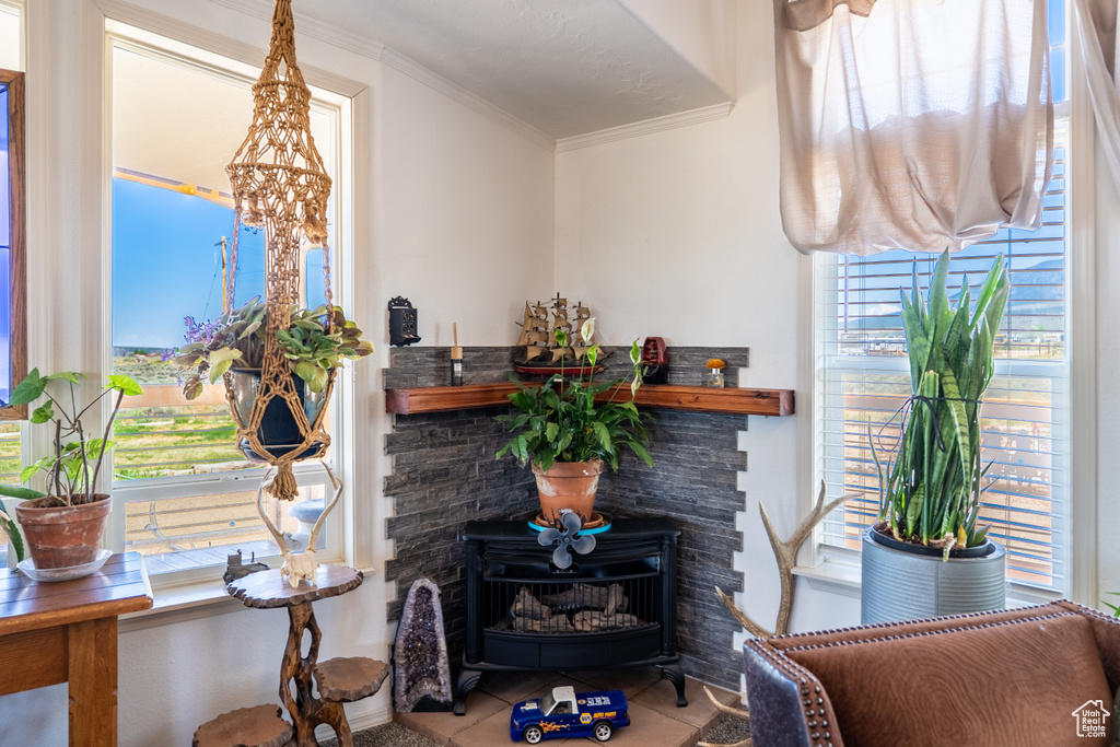 Tiled living room featuring ornamental molding