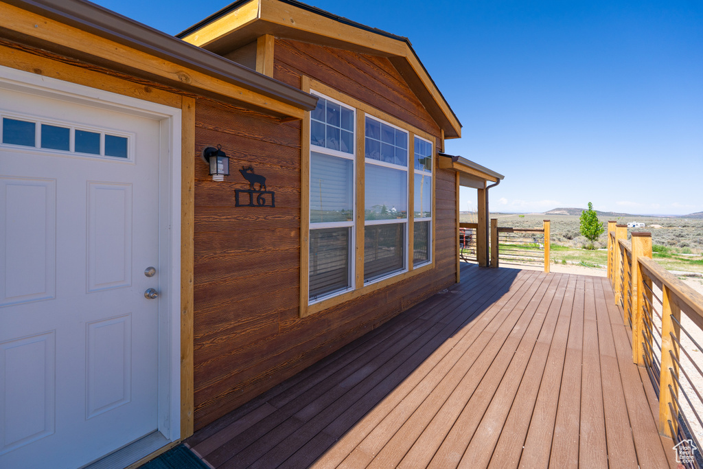 Wooden terrace featuring a mountain view