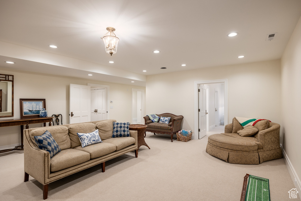 Living room featuring light colored carpet, recessed lighting, and baseboards