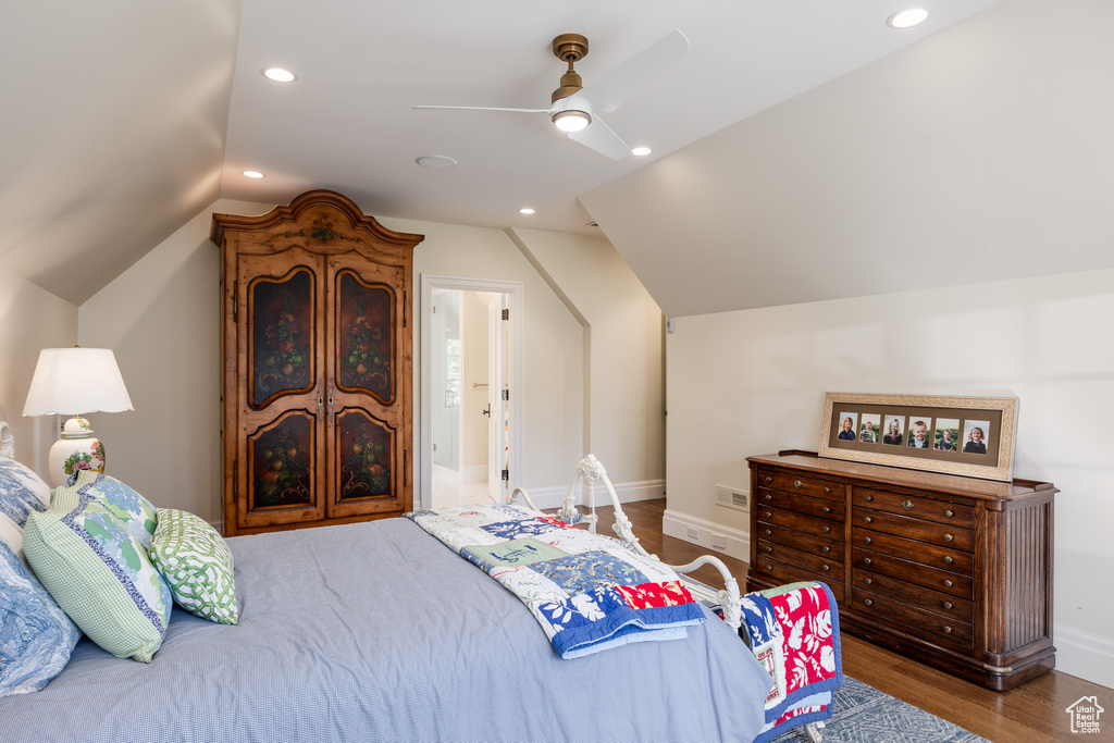 Bedroom with vaulted ceiling, baseboards, wood finished floors, a ceiling fan, and recessed lighting