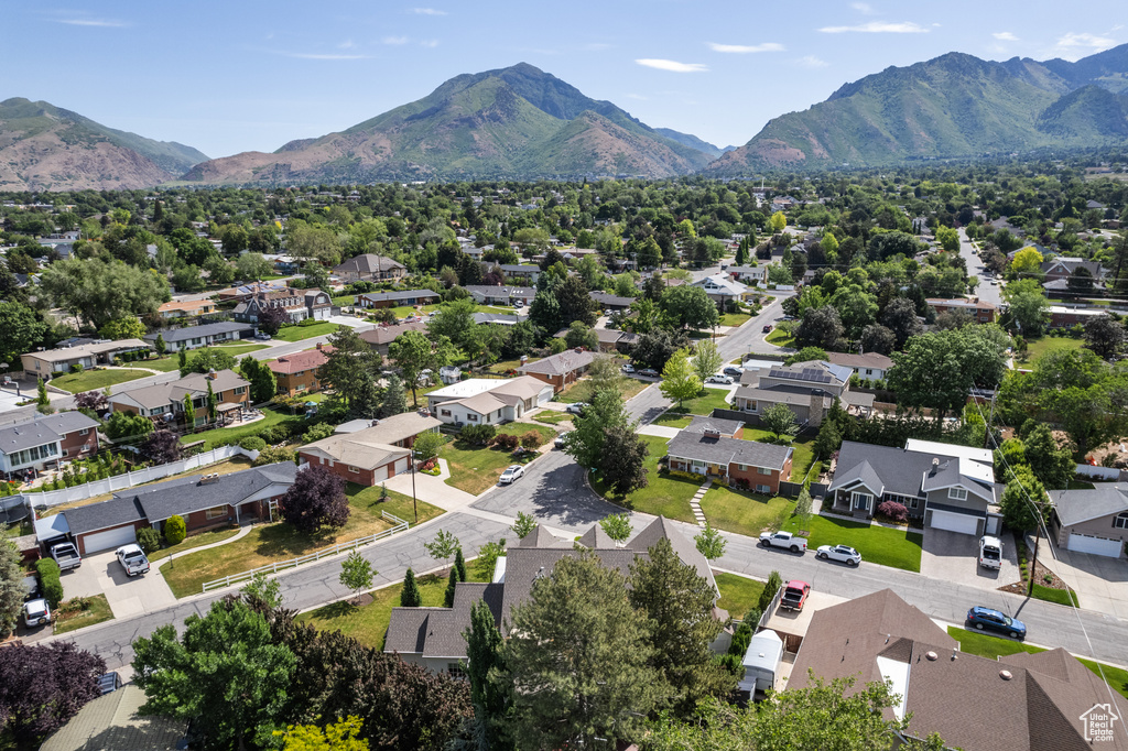 Aerial view of residential area featuring mountains