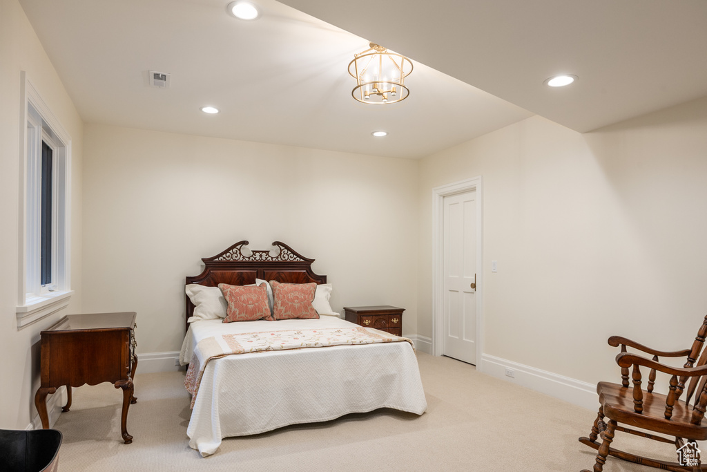 Bedroom featuring light carpet, recessed lighting, baseboards, and a chandelier