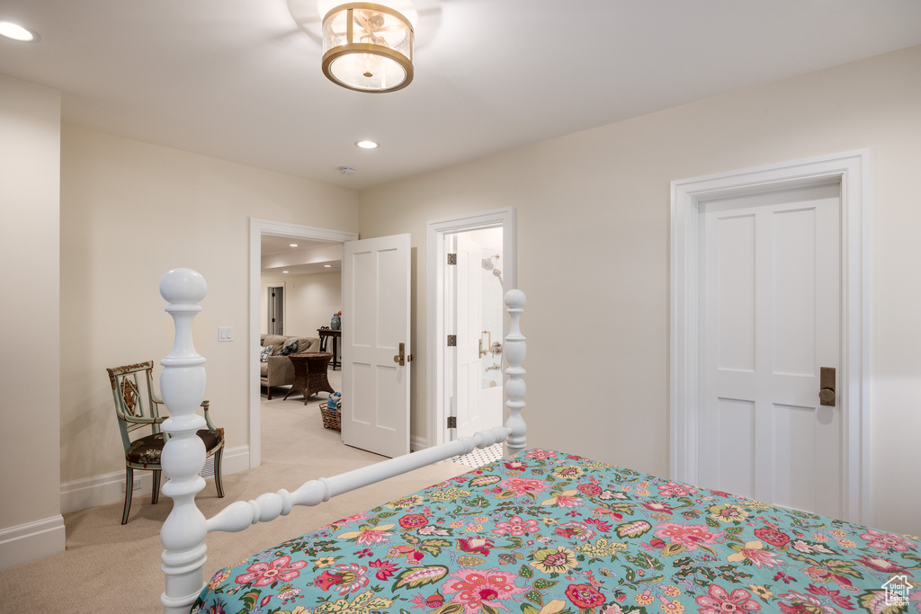 Bedroom featuring light colored carpet, recessed lighting, and baseboards