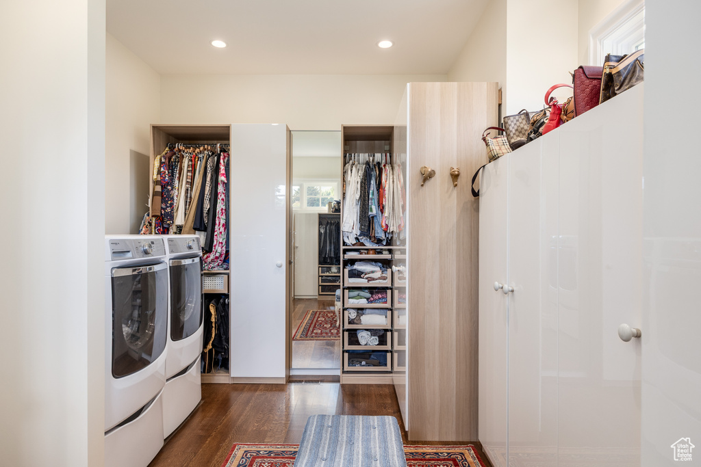 Washroom featuring washer and dryer, wood finished floors, and recessed lighting