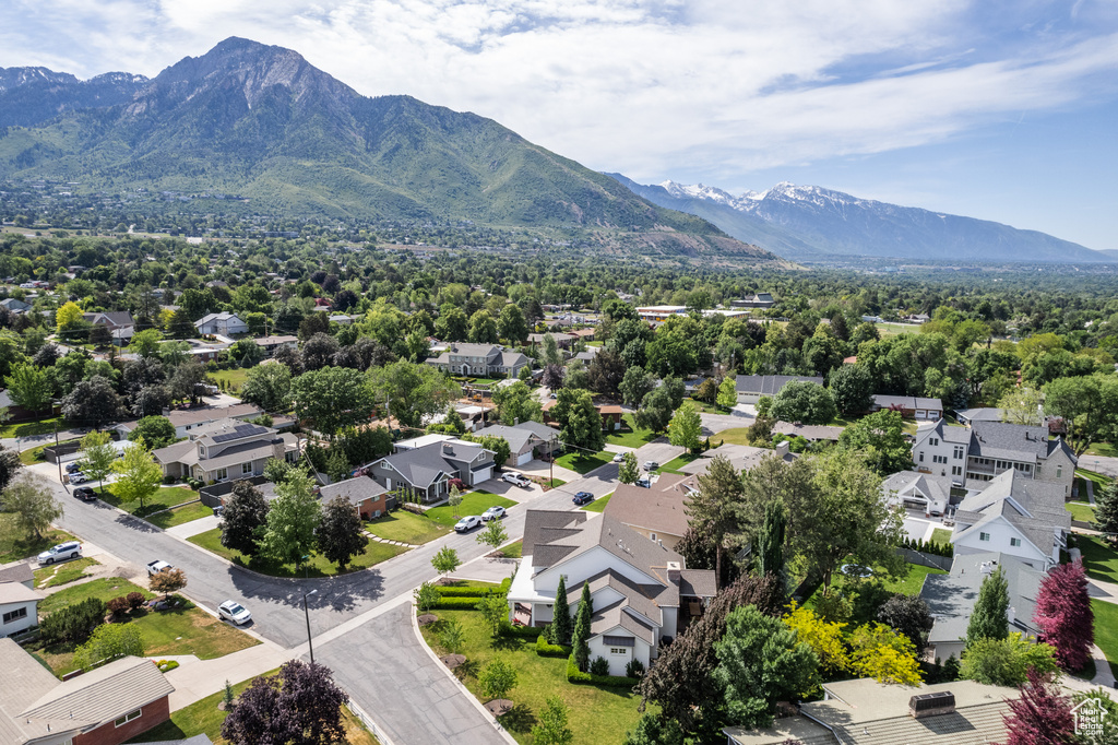 Aerial perspective of suburban area with a mountain backdrop
