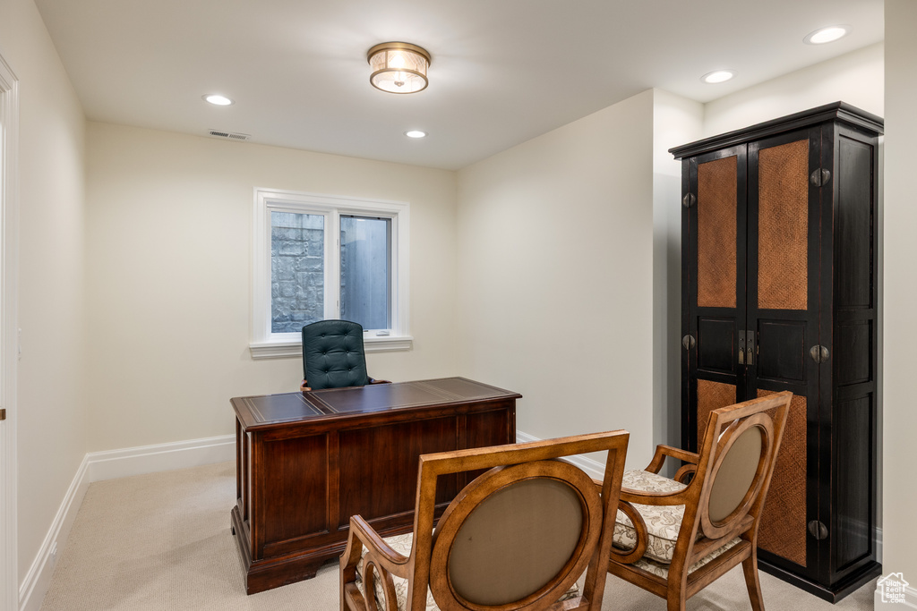 Office space featuring light colored carpet, baseboards, and recessed lighting