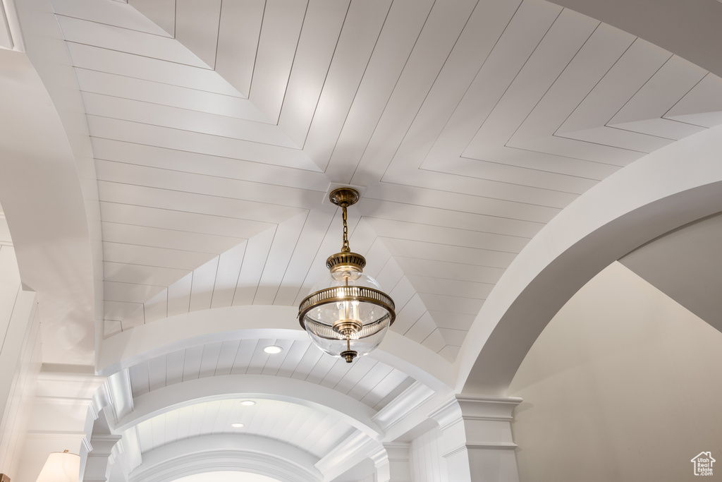 Detailed view of arched walkways, ornate columns, and recessed lighting