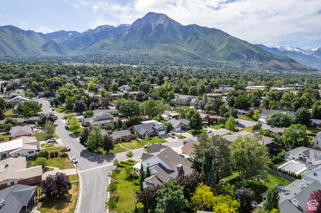 Aerial perspective of suburban area featuring a mountainous background