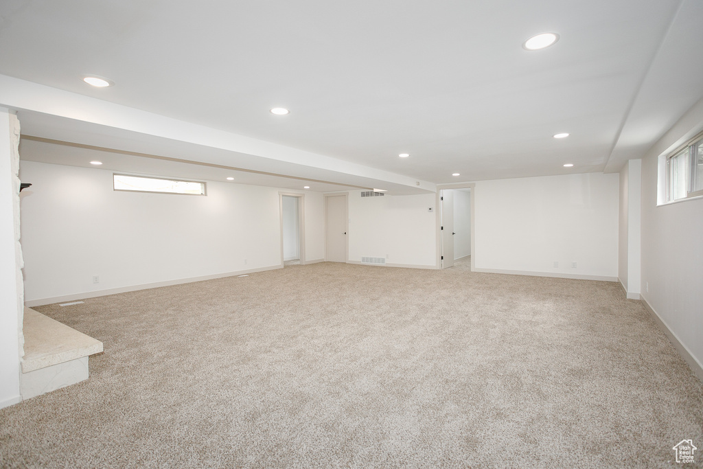 Below grade area with recessed lighting, carpet flooring, and baseboards
