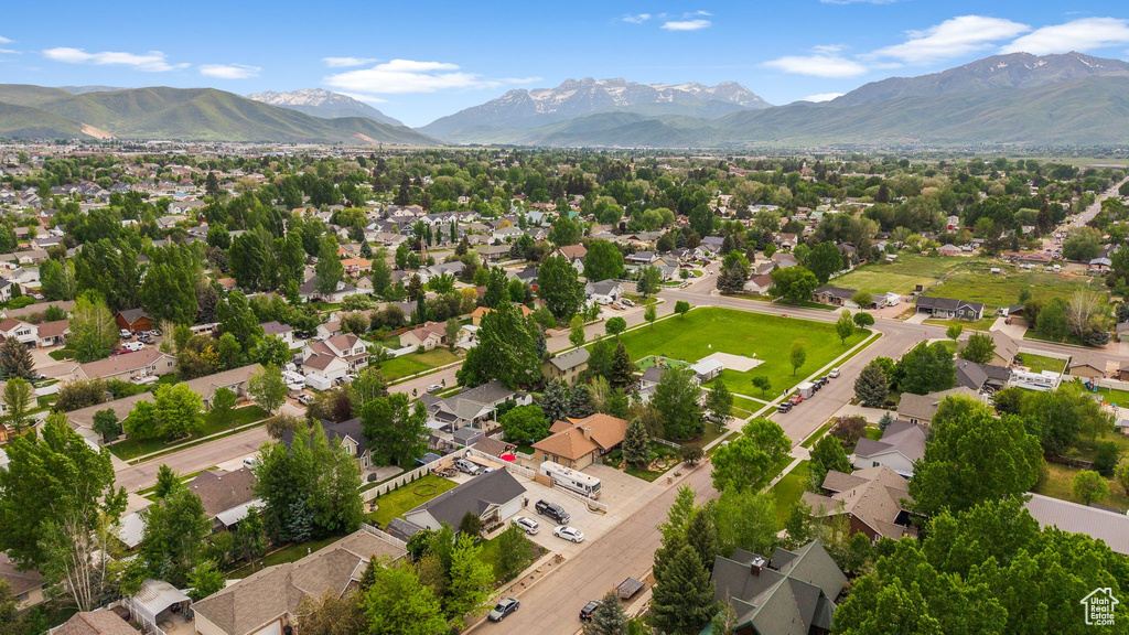 Aerial view of residential area featuring a mountainous background
