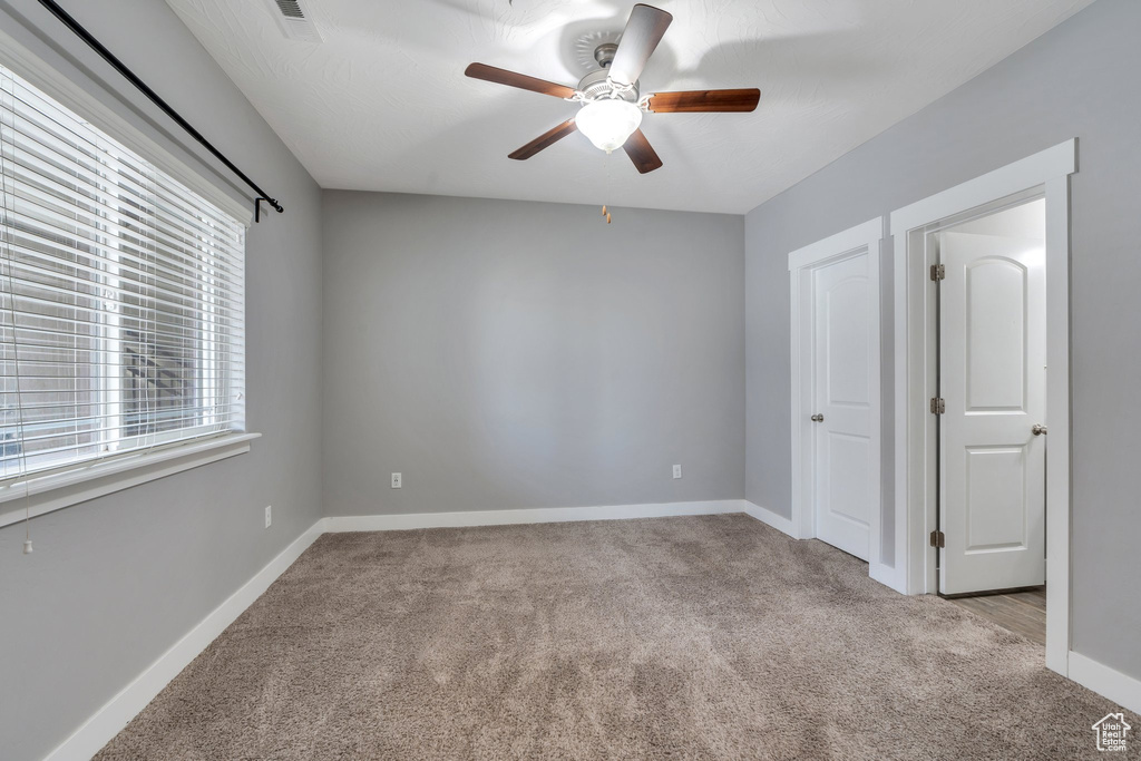 Unfurnished bedroom featuring carpet flooring and baseboards