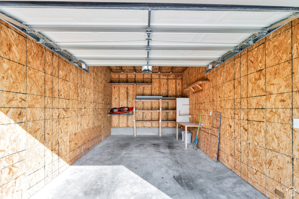 Garage featuring a garage door opener