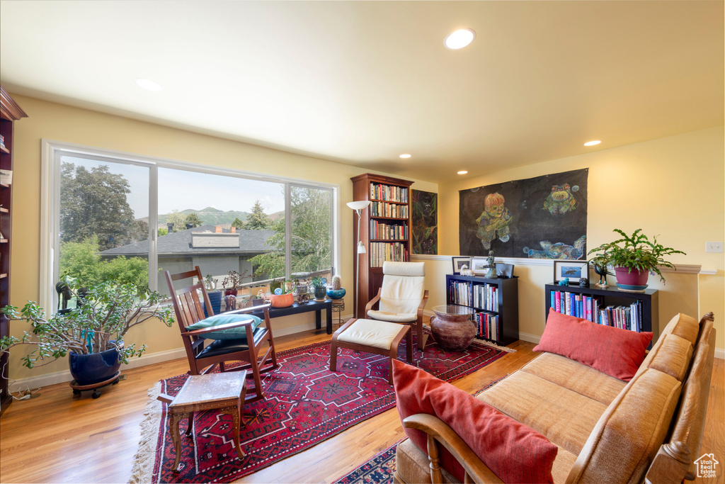 Living room with wood finished floors and recessed lighting