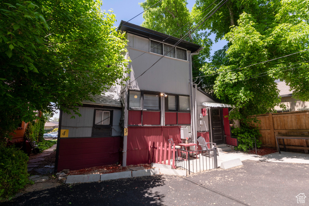 Rear view of house with a patio and entry steps