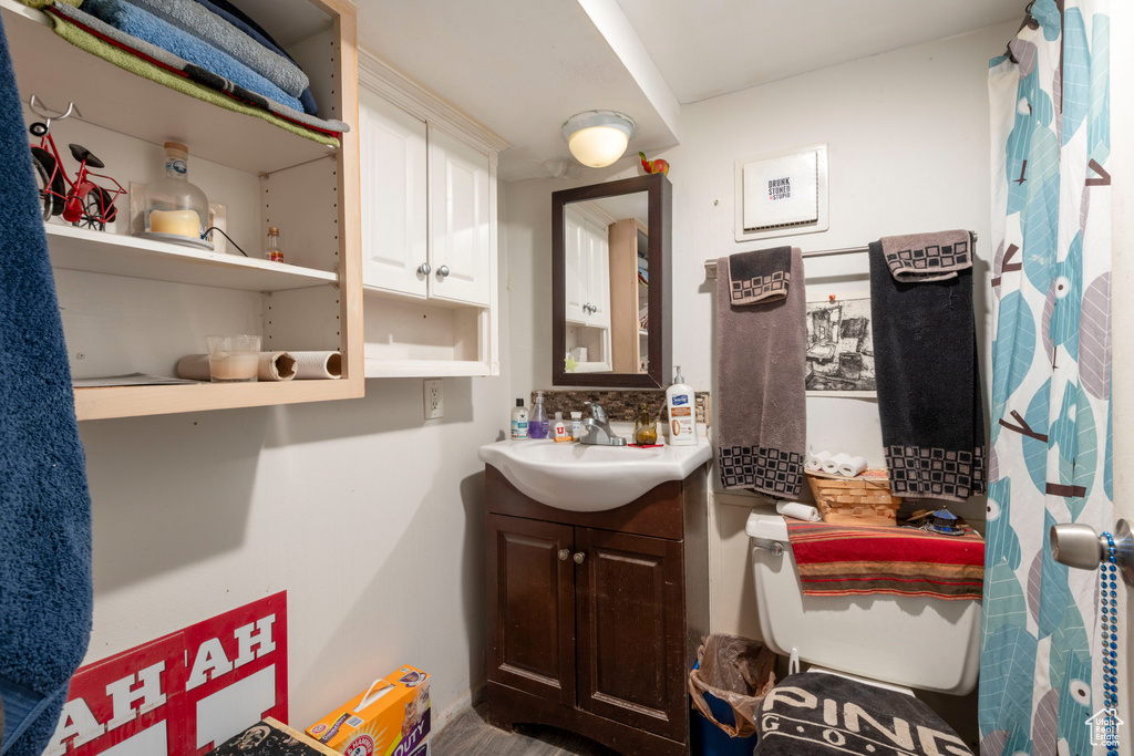 Bathroom featuring vanity and toilet