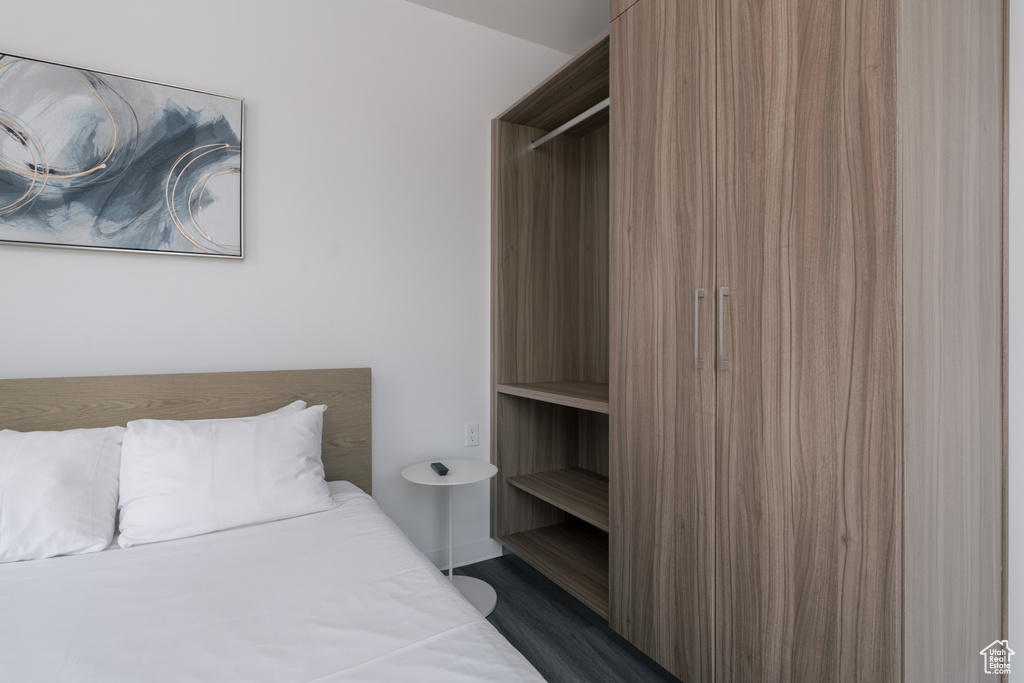 Bedroom with dark wood finished floors