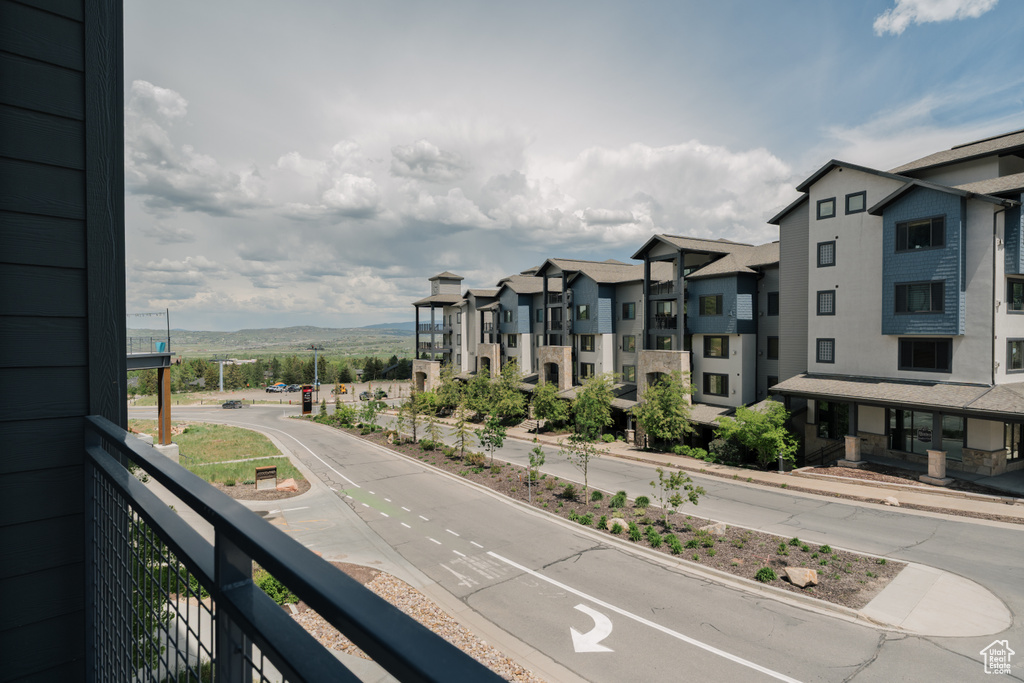 Balcony featuring a mountain view and a residential view