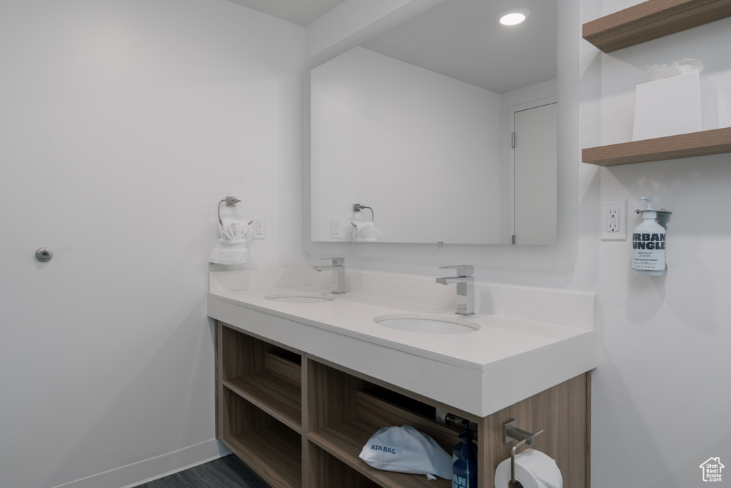 Bathroom with double vanity and recessed lighting