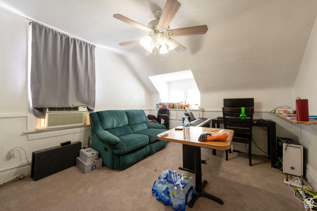 Office area with carpet floors, lofted ceiling, a ceiling fan, and cooling unit
