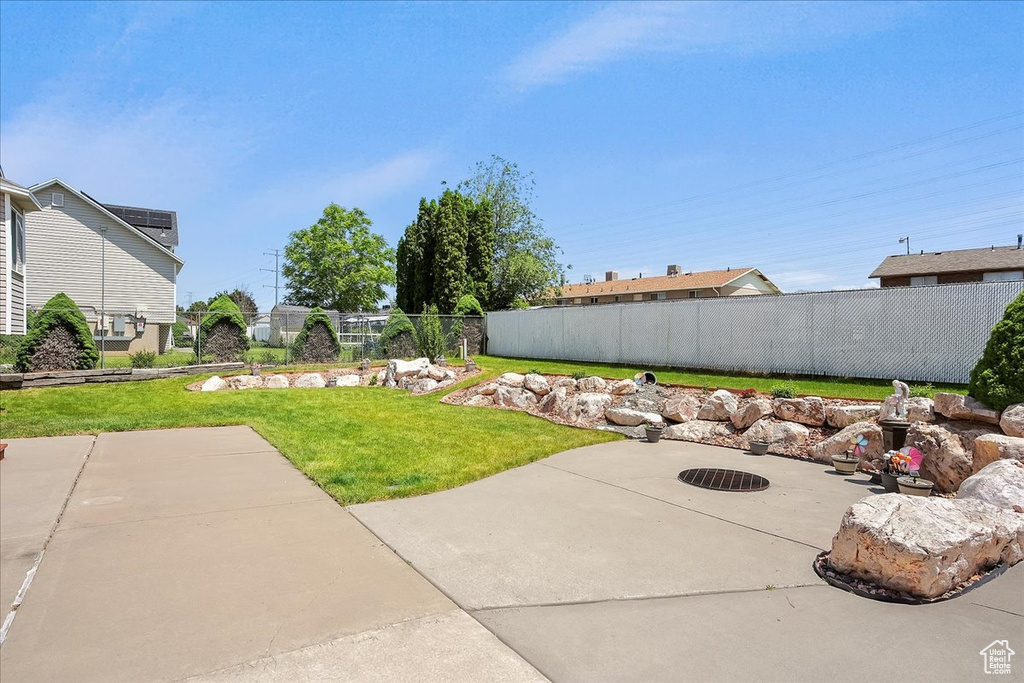 View of yard with a patio area