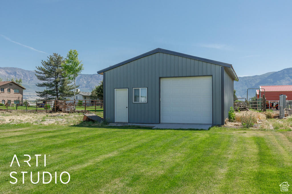 Detached garage with a mountain view