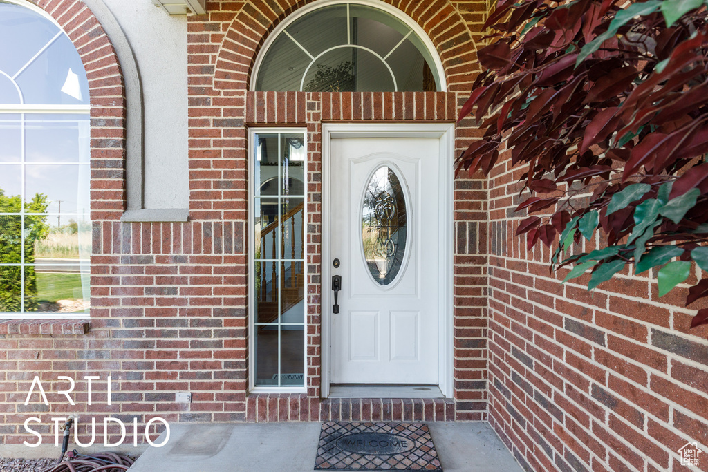 Entrance to property with brick siding