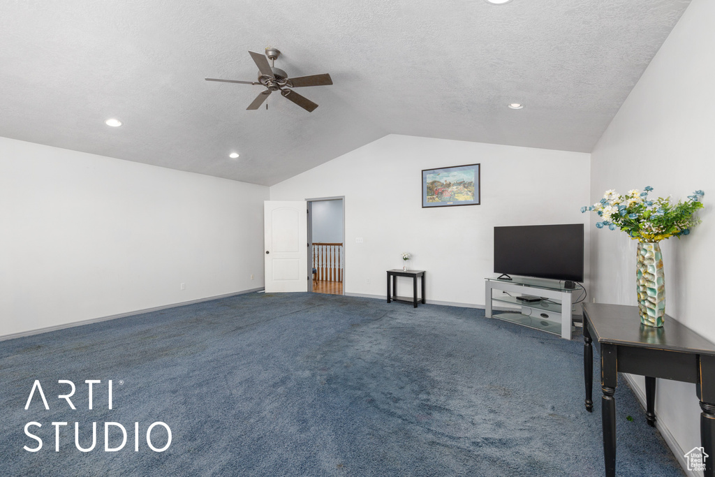 Unfurnished living room featuring a ceiling fan, vaulted ceiling, carpet, recessed lighting, and baseboards