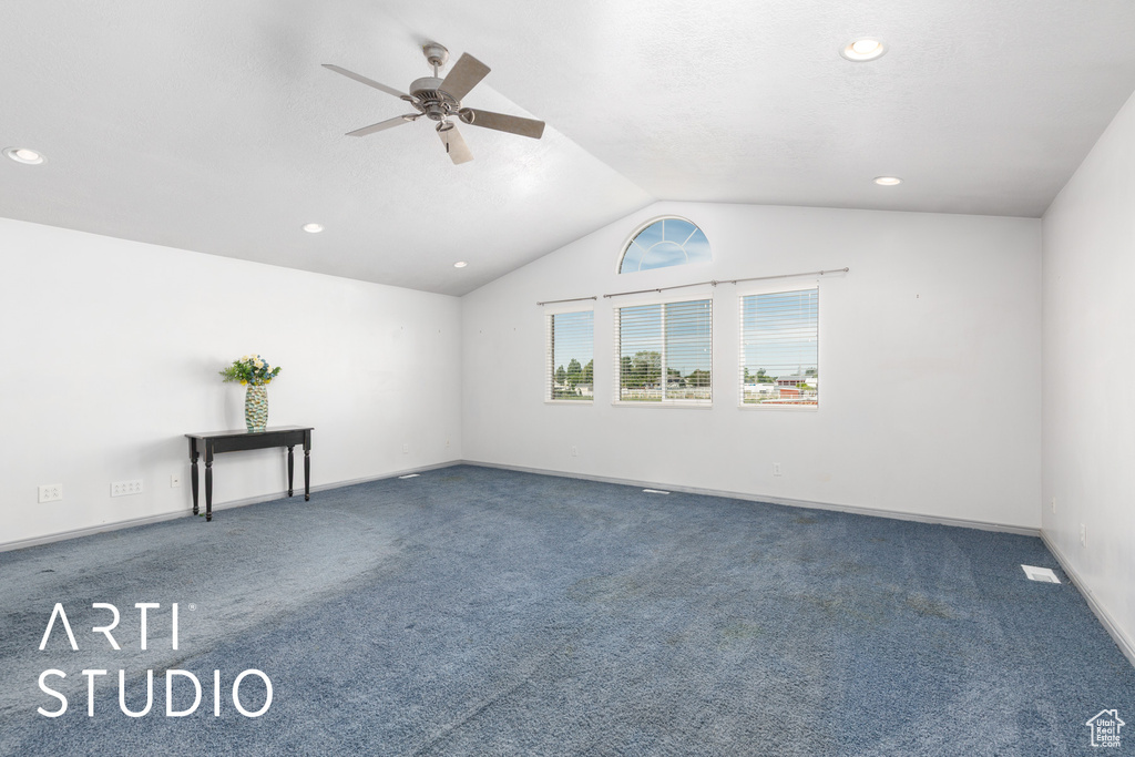 Empty room with ceiling fan, carpet, vaulted ceiling, recessed lighting, and baseboards