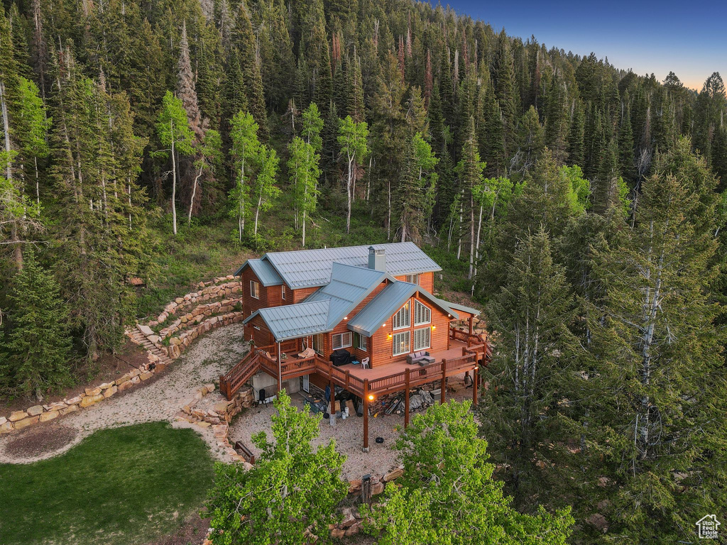 View of subject property featuring a heavily wooded area