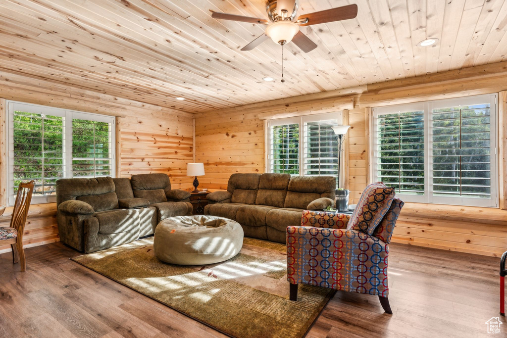 Living room with wooden ceiling, a ceiling fan, wood finished floors, plenty of natural light, and recessed lighting