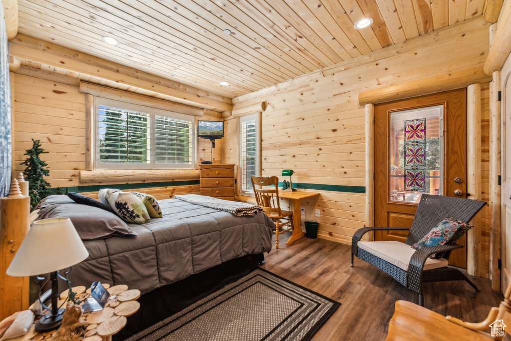 Bedroom featuring wood ceiling, wood finished floors, recessed lighting, and wooden walls