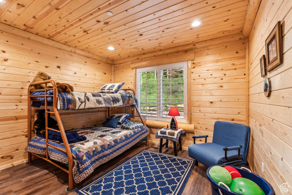 Bedroom featuring recessed lighting, wood finished floors, wood ceiling, and wood walls