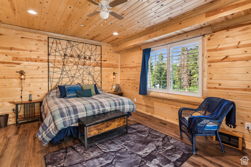 Bedroom featuring recessed lighting, wooden walls, wood finished floors, and wood ceiling