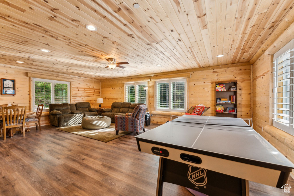 Recreation room featuring wood ceiling, wood finished floors, wood walls, recessed lighting, and ceiling fan