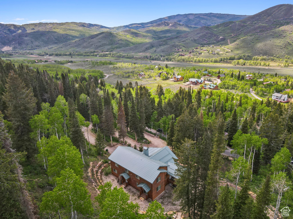 View from above of property with a mountain backdrop