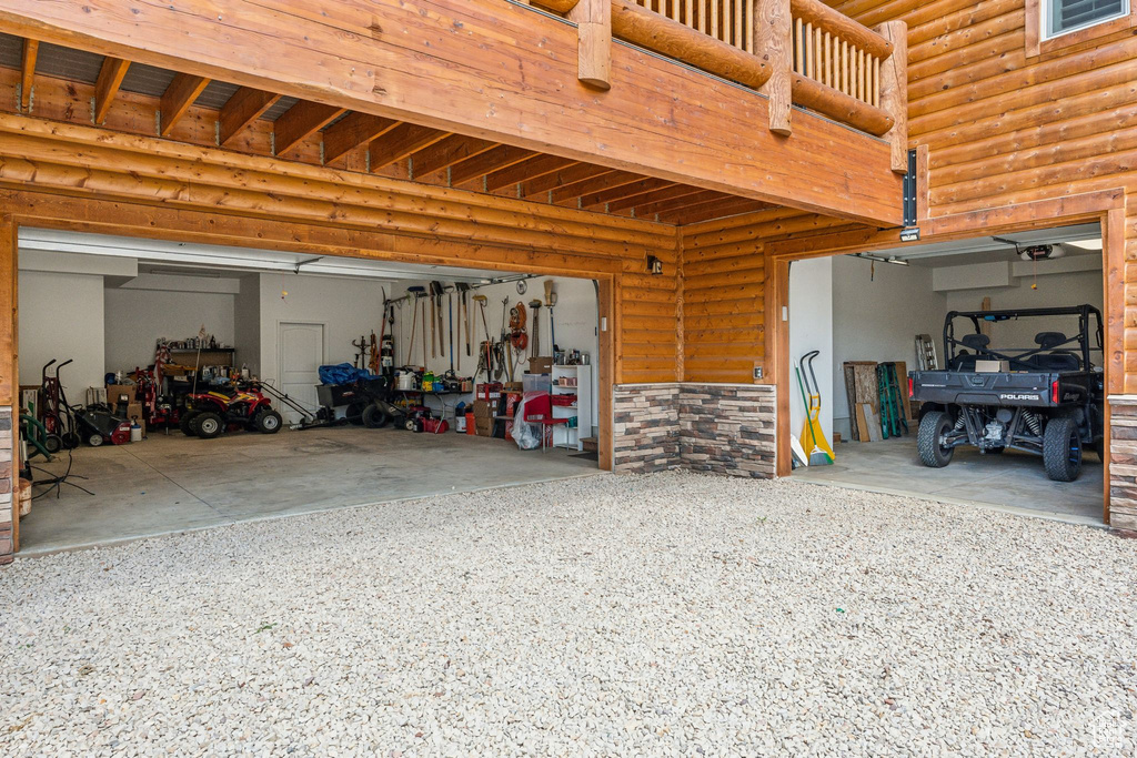 Garage featuring gravel driveway