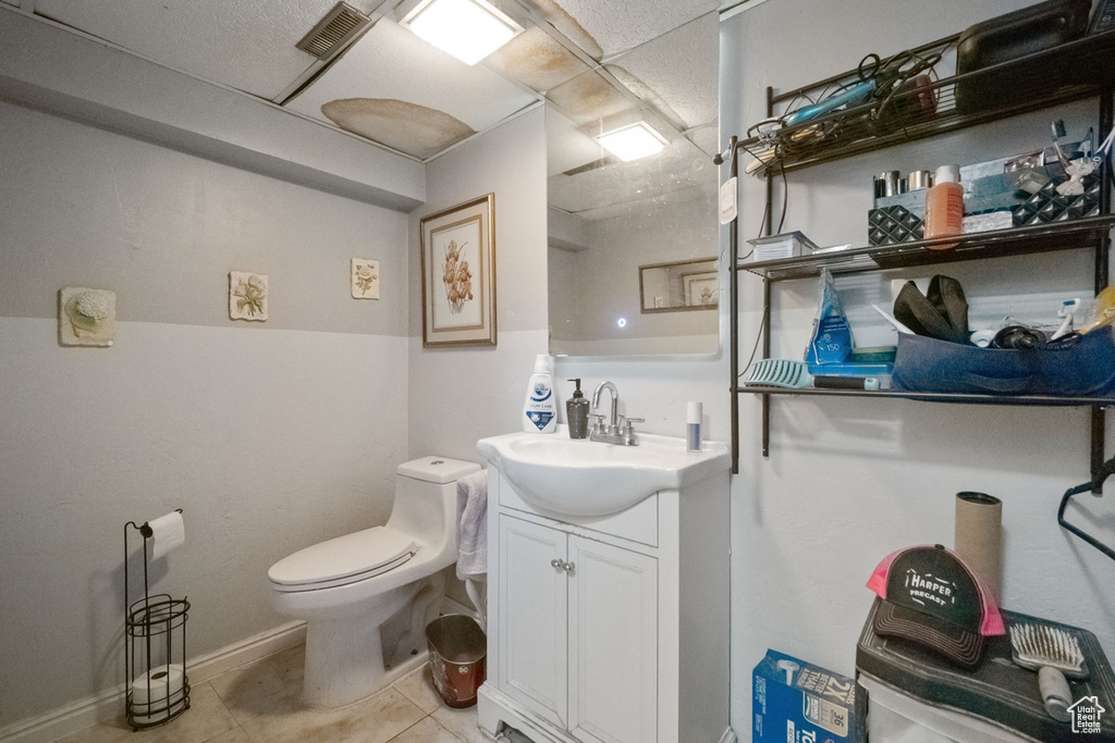 Bathroom with vanity and tile patterned flooring
