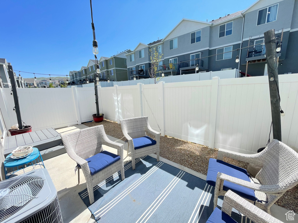 Fenced backyard with a residential view and a patio