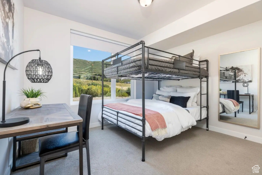 Bedroom with baseboards and carpet floors