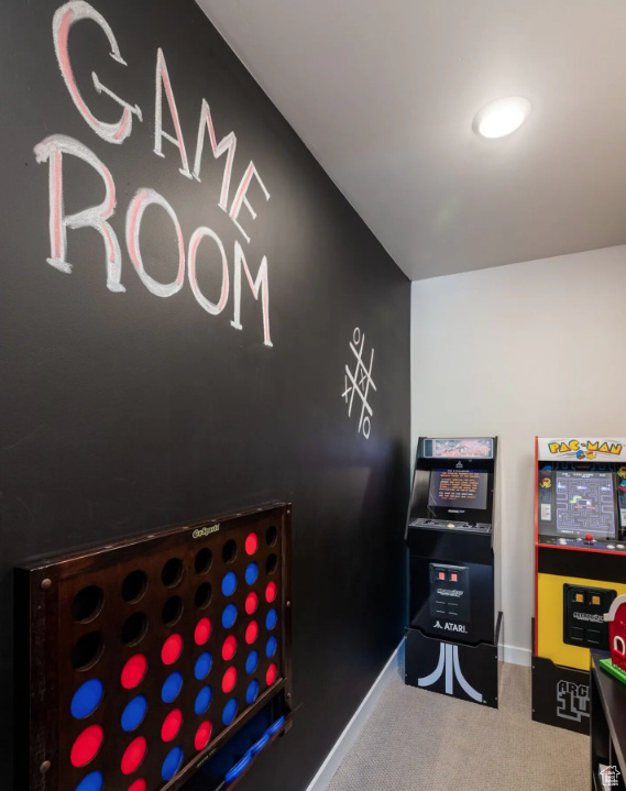 Rec room featuring carpet floors and baseboards