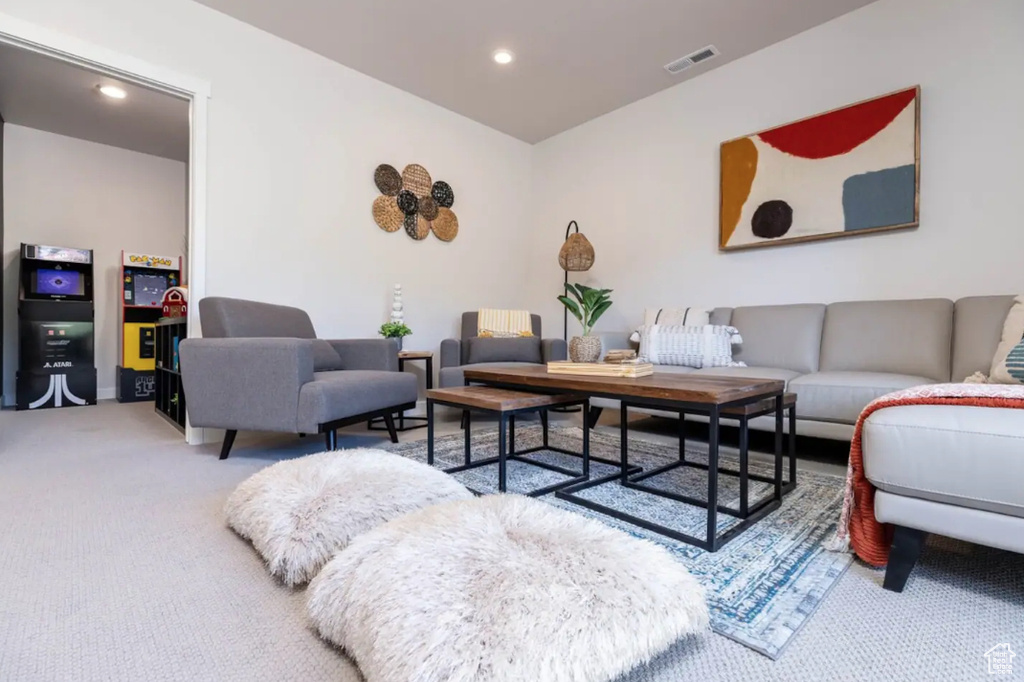 Carpeted living area featuring recessed lighting