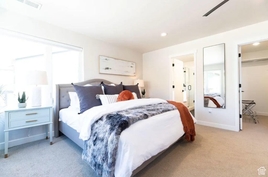 Carpeted bedroom featuring baseboards, recessed lighting, and a spacious closet