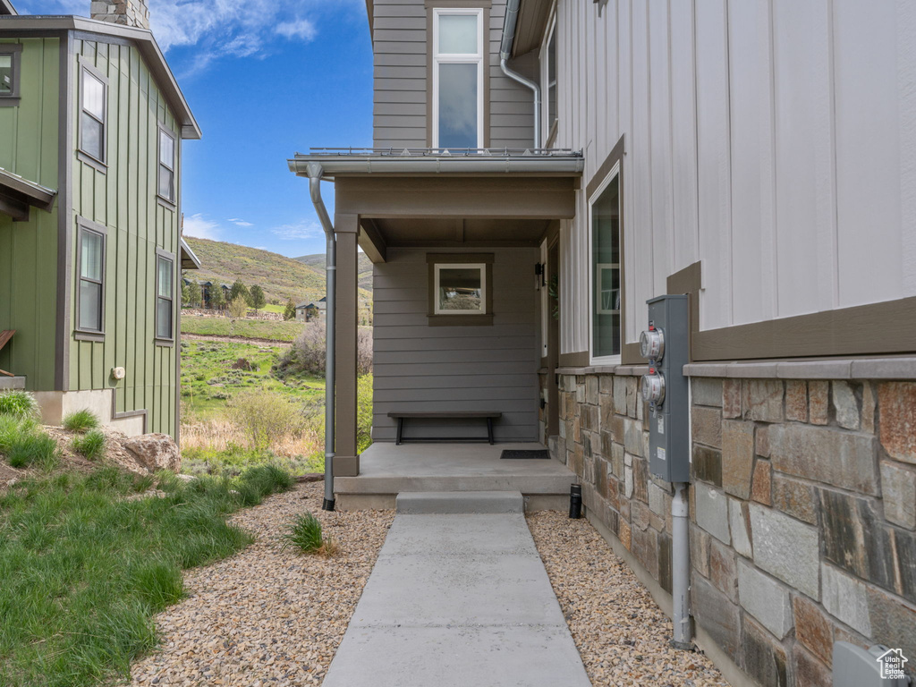 Property entrance featuring a mountain view and board and batten siding