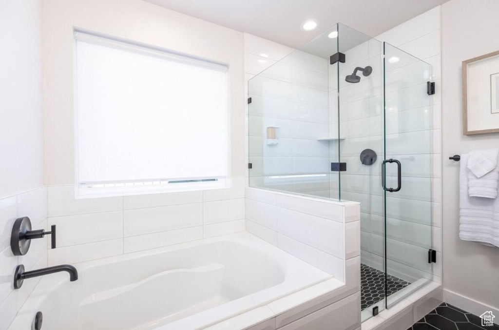 Bathroom with a bath, a stall shower, recessed lighting, and tile patterned floors