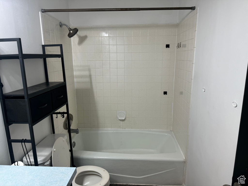 Full bath featuring toilet,  shower combination, and vanity