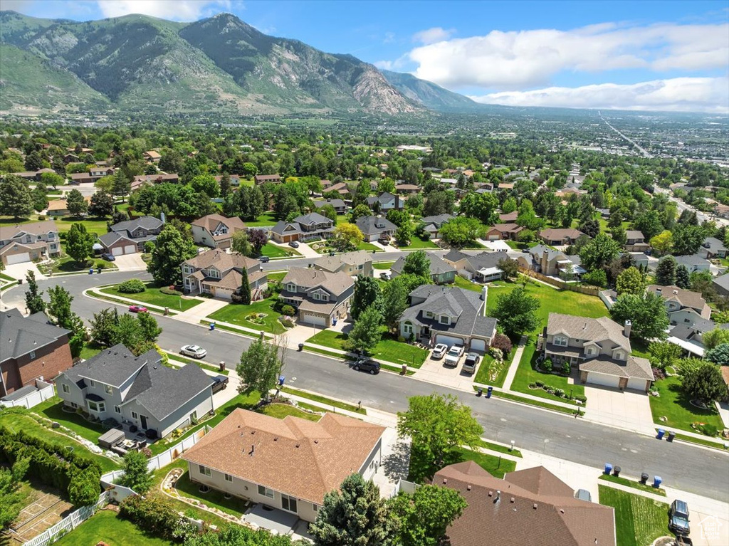 Aerial perspective of suburban area with a mountainous background