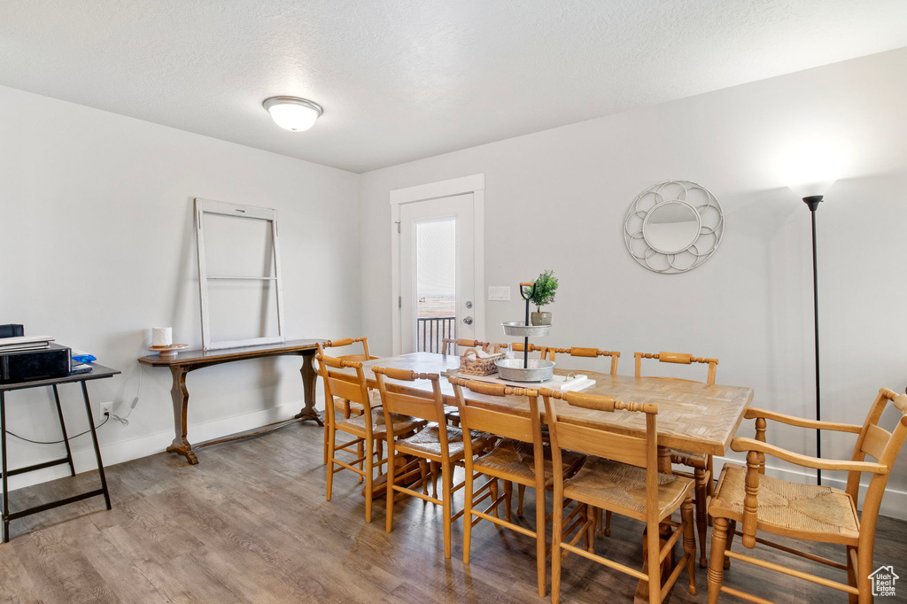 Dining area with wood finished floors and baseboards
