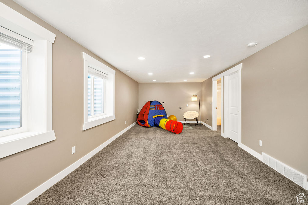 Unfurnished bedroom featuring carpet flooring, baseboards, and recessed lighting