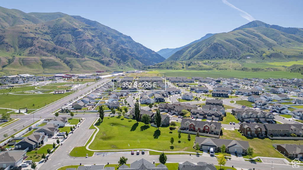 View of property location featuring a mountainous background and nearby suburban area